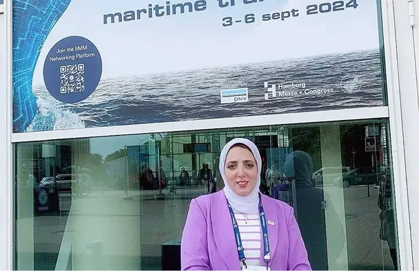 Golden Ocean representative at a marine industry exhibition entrance