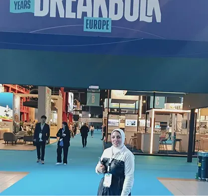 Golden Ocean representative at a maritime exhibition entrance